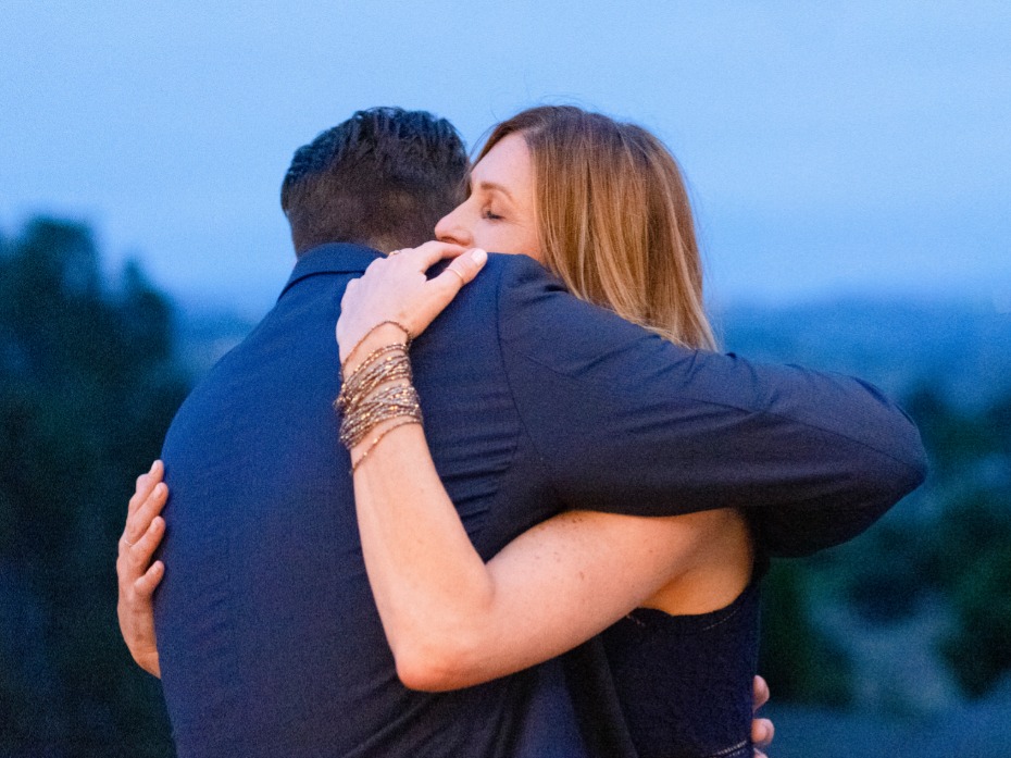 Loving embrace between a man and a woman with scenic background