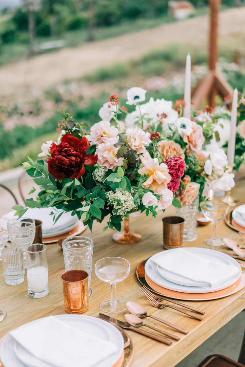 Elegant wedding table setting with a floral centerpiece and place settings