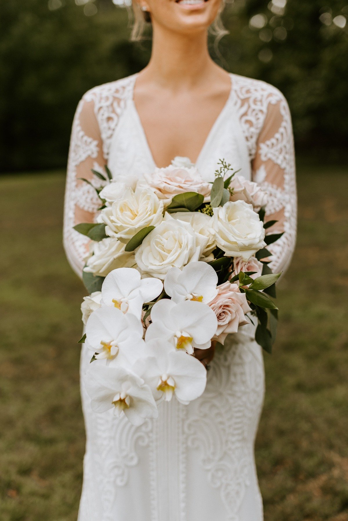 orchid, rose and greenery bouquet