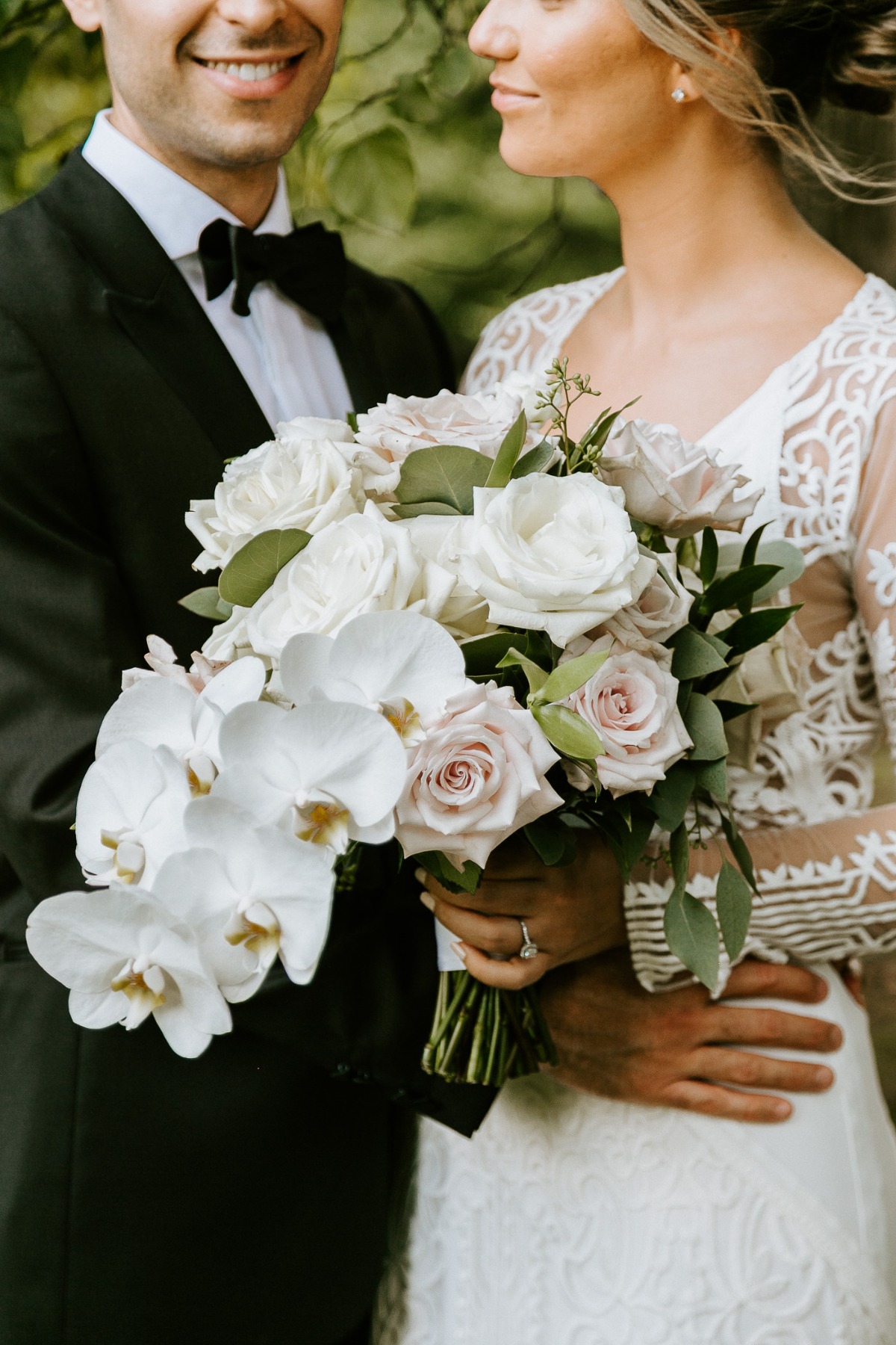 orchid, rose and greenery wedding bouquet
