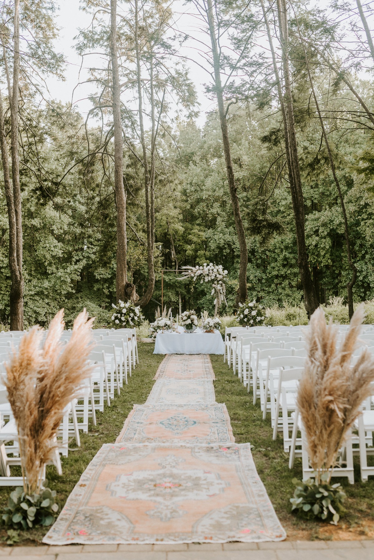 outdoor wedding ceremony with vintage rugs