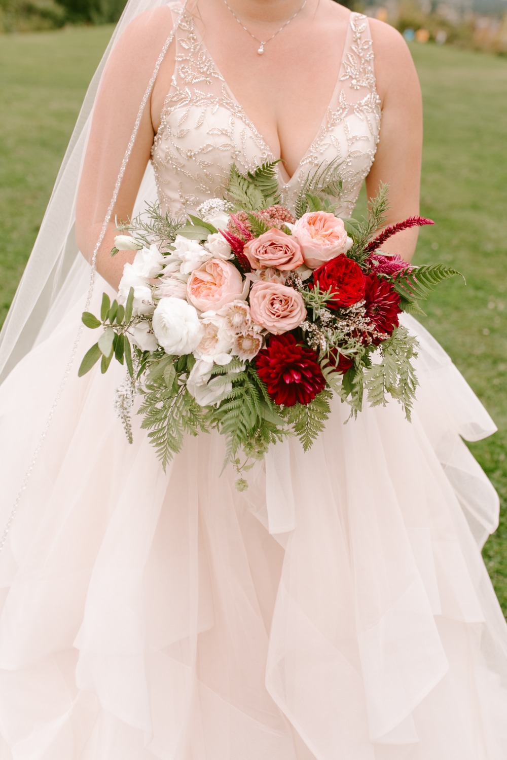 blush pin and red wedding bouquet