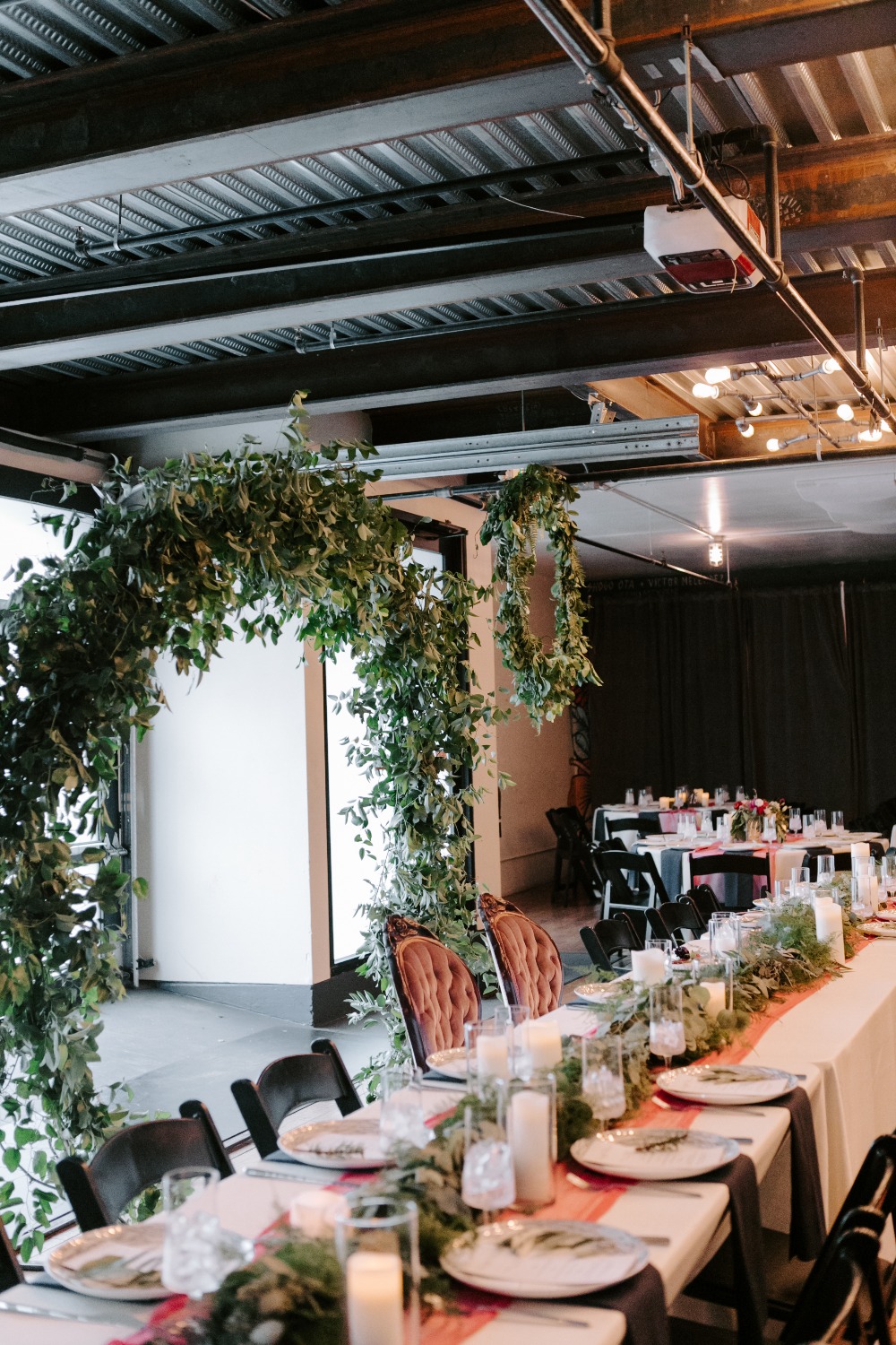 Head table surrounded by greenery