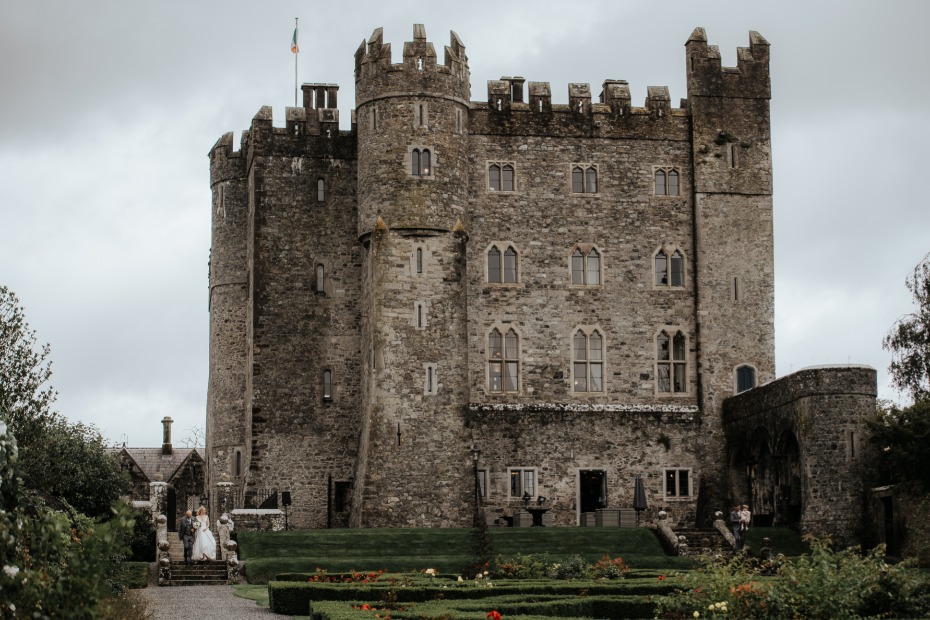 Medieval castle with bride and groom on wedding day