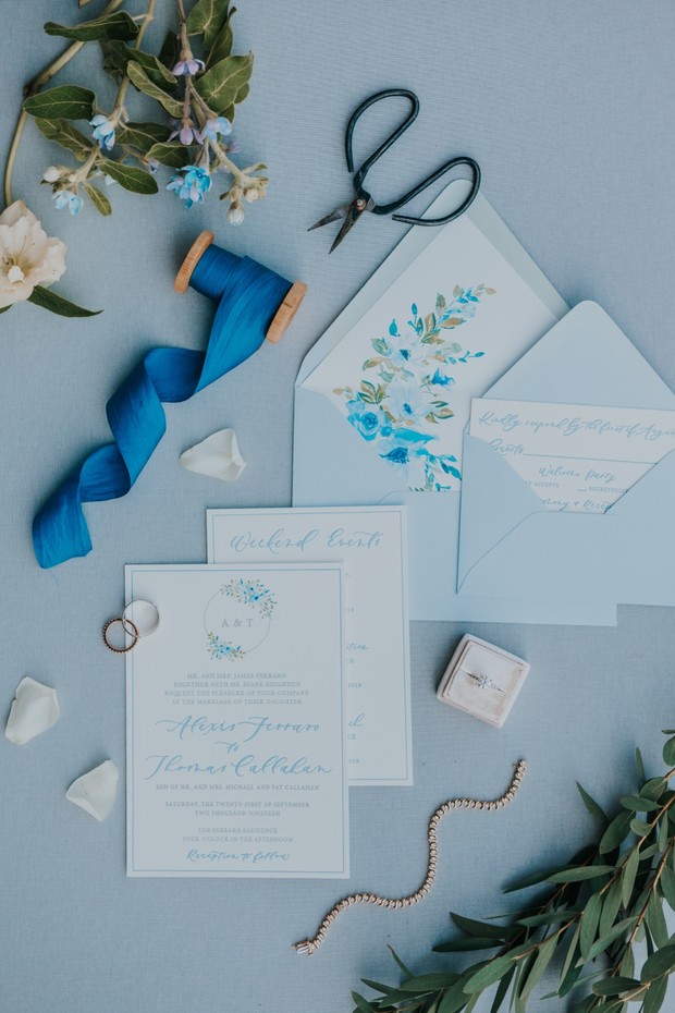 blue wedding invitations with flat lay styling