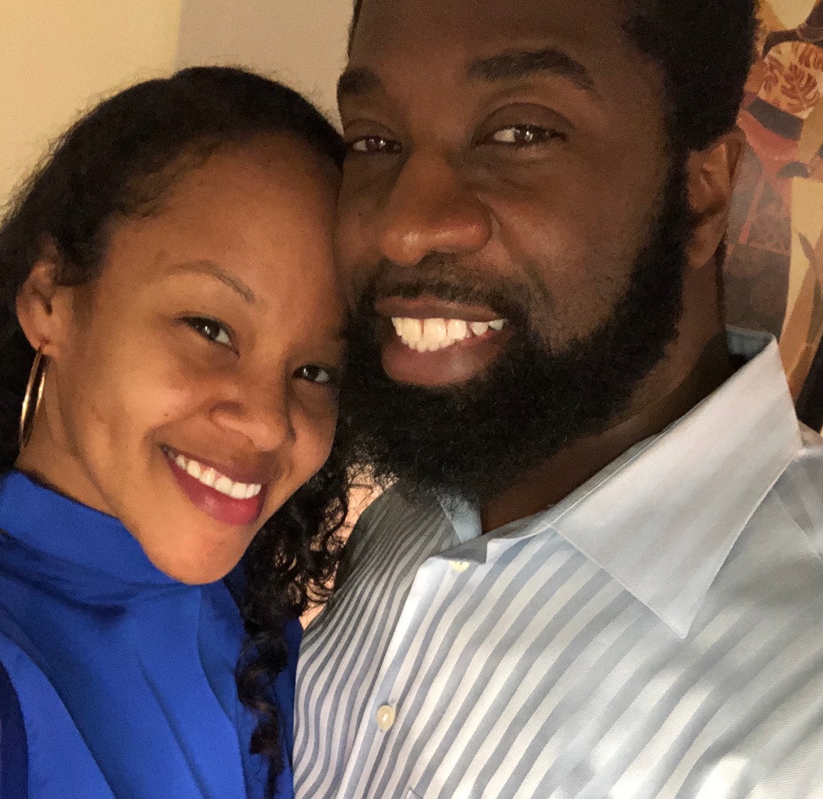 Smiling Black couple posing for a happy photo together