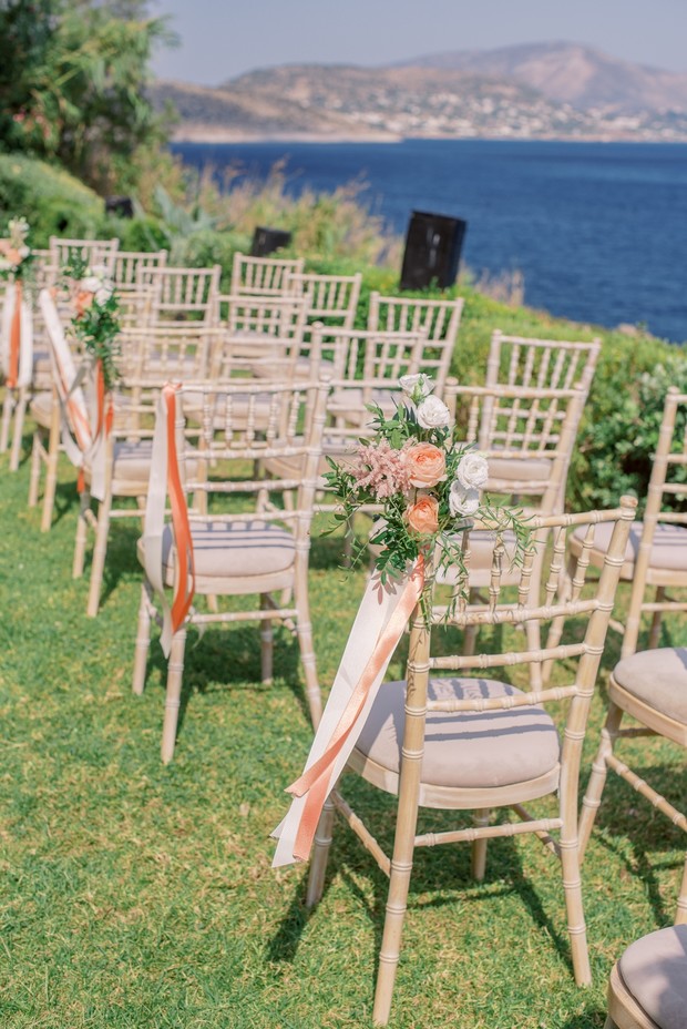 wedding chairs with ribbon and florals