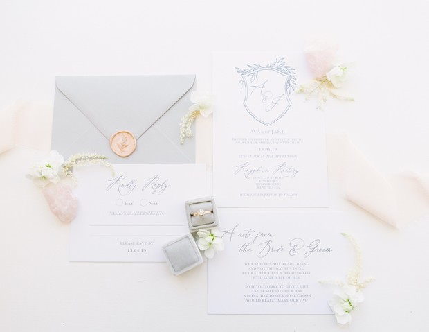 Elegant wedding stationary and ring with floral accents