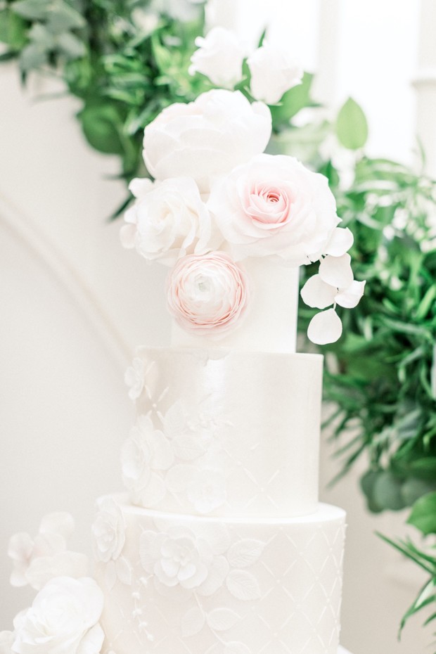 Elegant white wedding cake with floral decorations