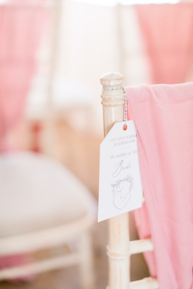 Reserved seat at a wedding for the mother of the bride with decor