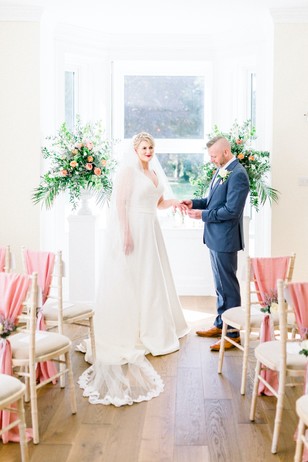 Bride and groom exchanging rings during a beautiful wedding ceremony