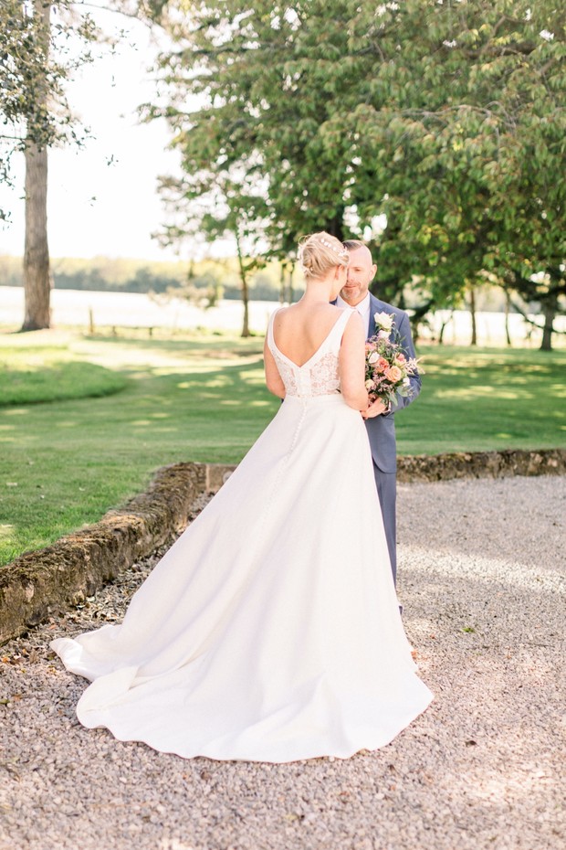 Bride and groom share a moment on their wedding day, outdoors
