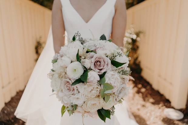 white and blush wedding bouquet with green accents