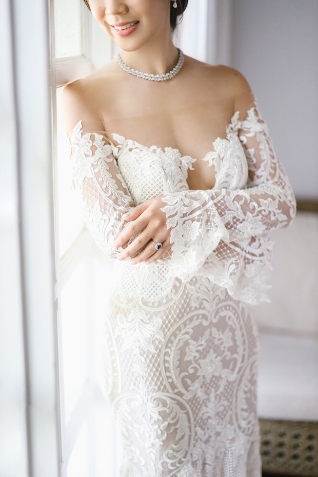 Off the shoulder illusion wedding dress paired with a diamond necklace