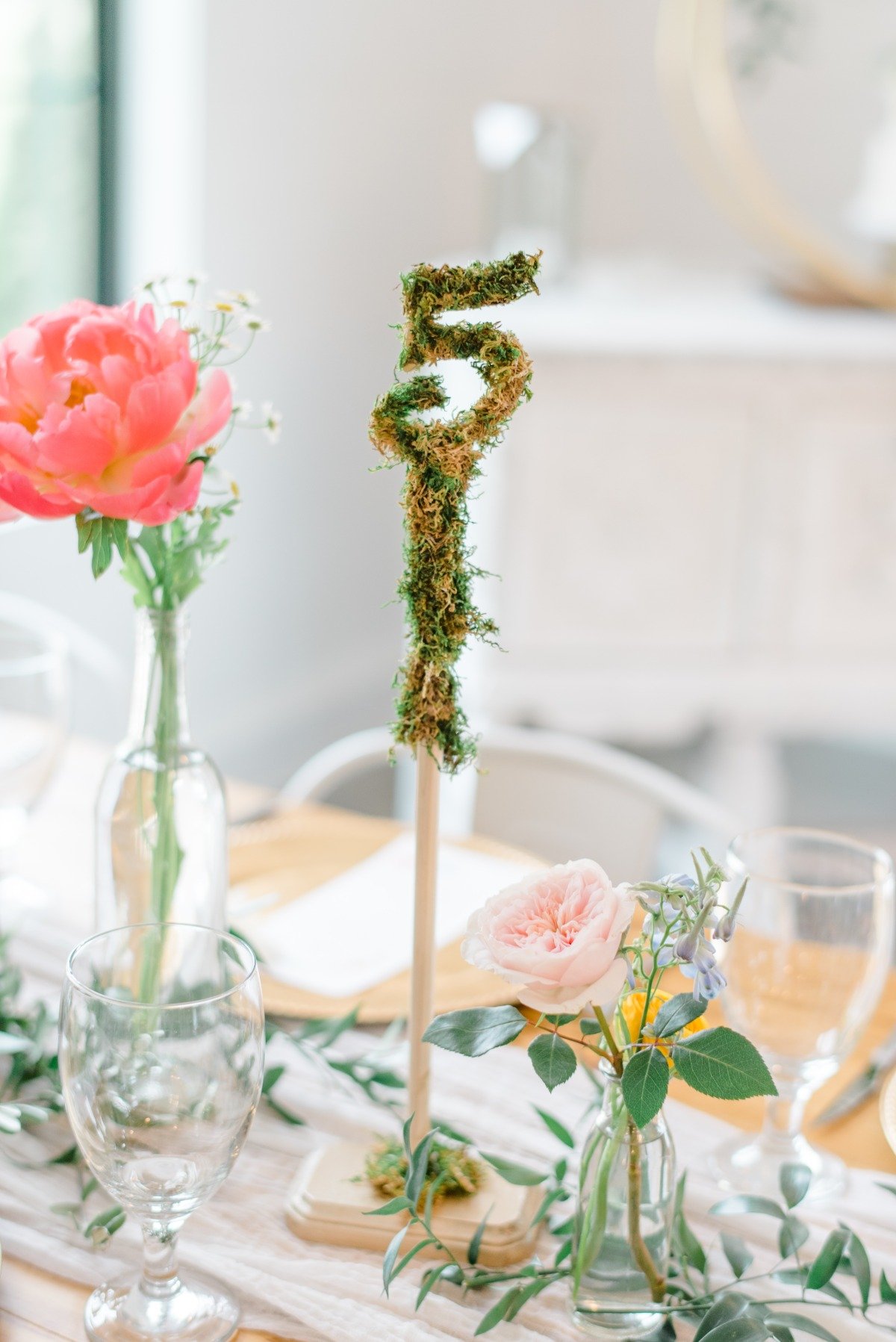 Moss covered table numbers