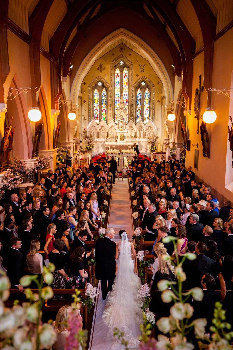 Bride walking down the aisle in a church wedding ceremony