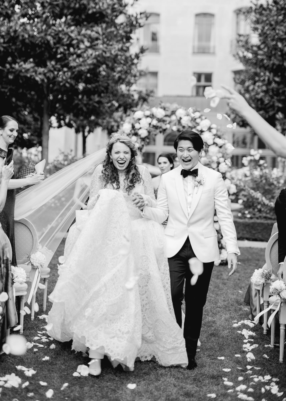 Joyful couple walking down the aisle after wedding ceremony
