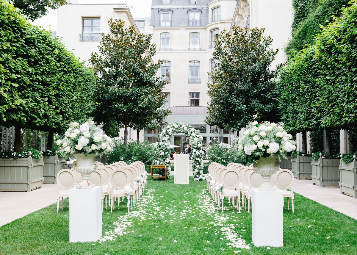 Elegant outdoor wedding ceremony venue with floral arch