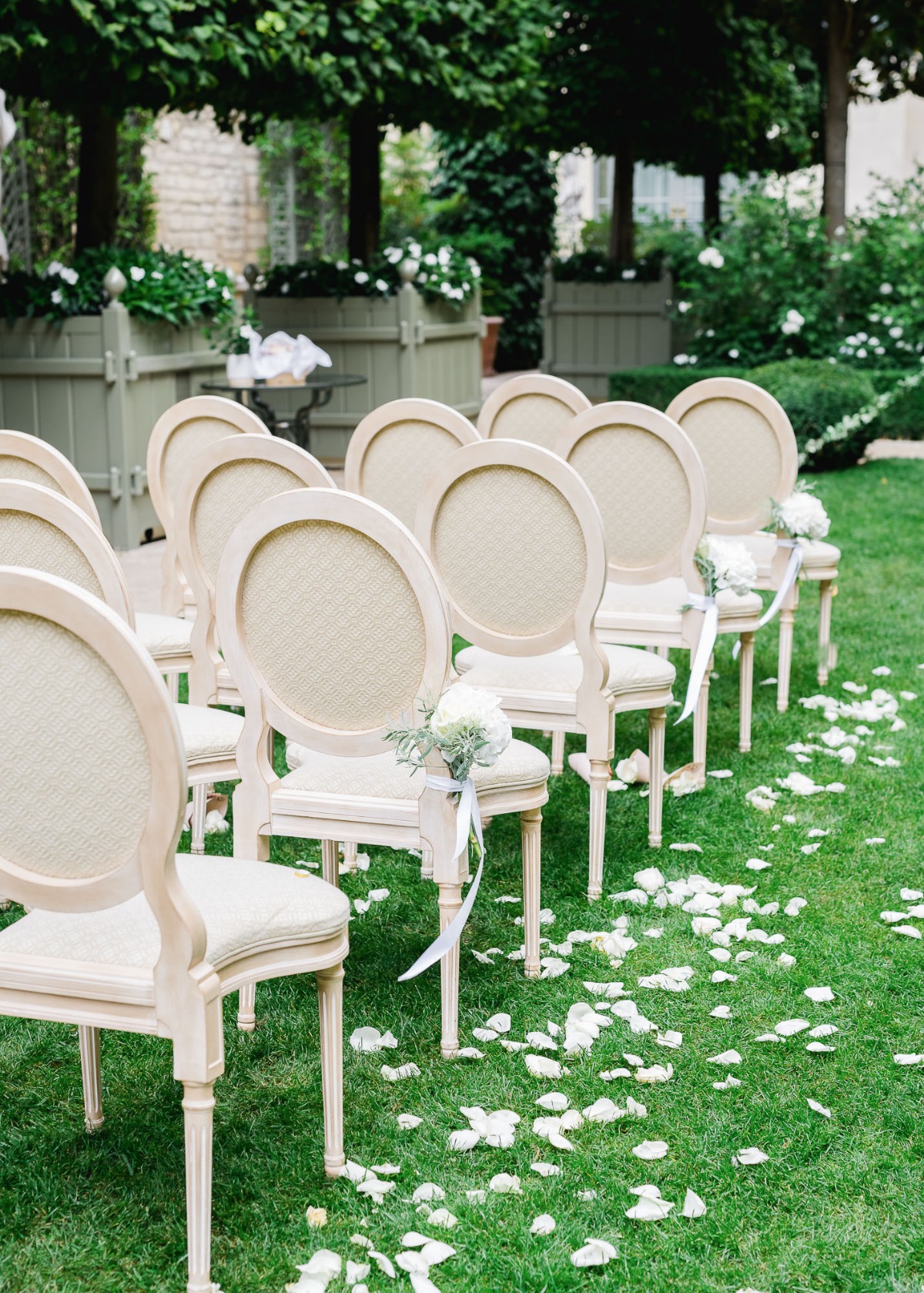 Elegant outdoor wedding seating arrangement with flower decor