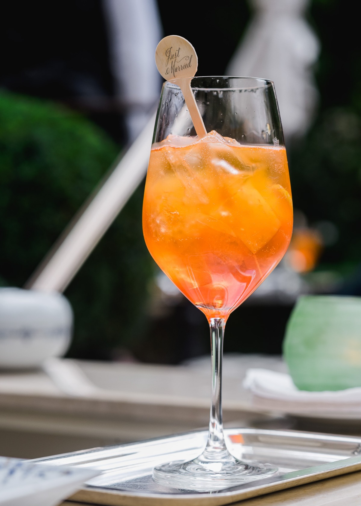 Festive orange cocktail with Just Married decor for the celebration