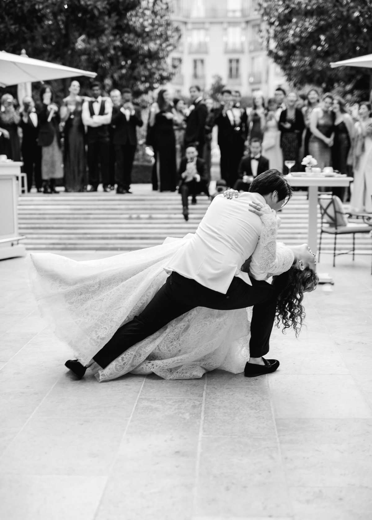 Elegant bride and groom dance dip at a wedding reception