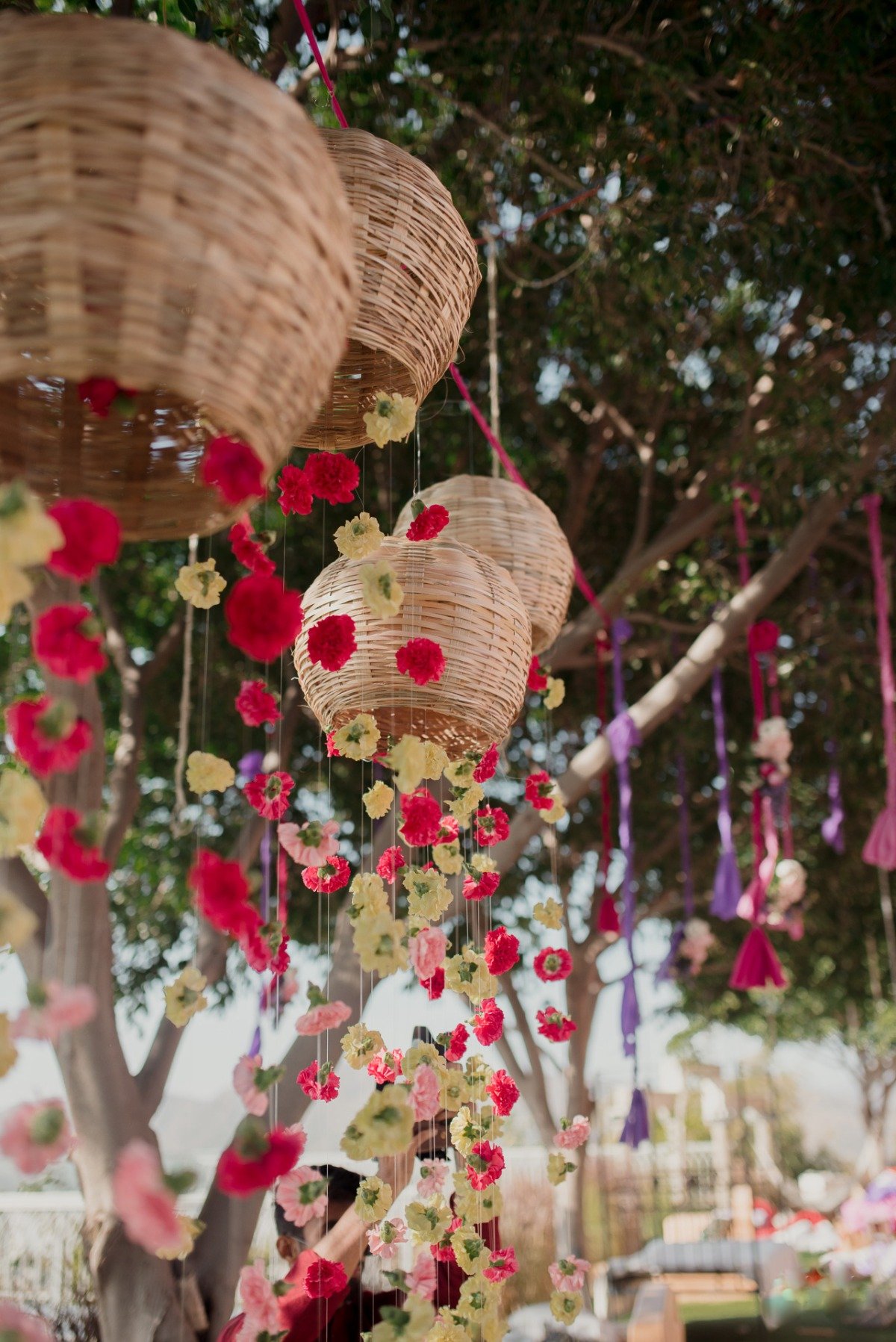 wicker baskets with florals hanging from them