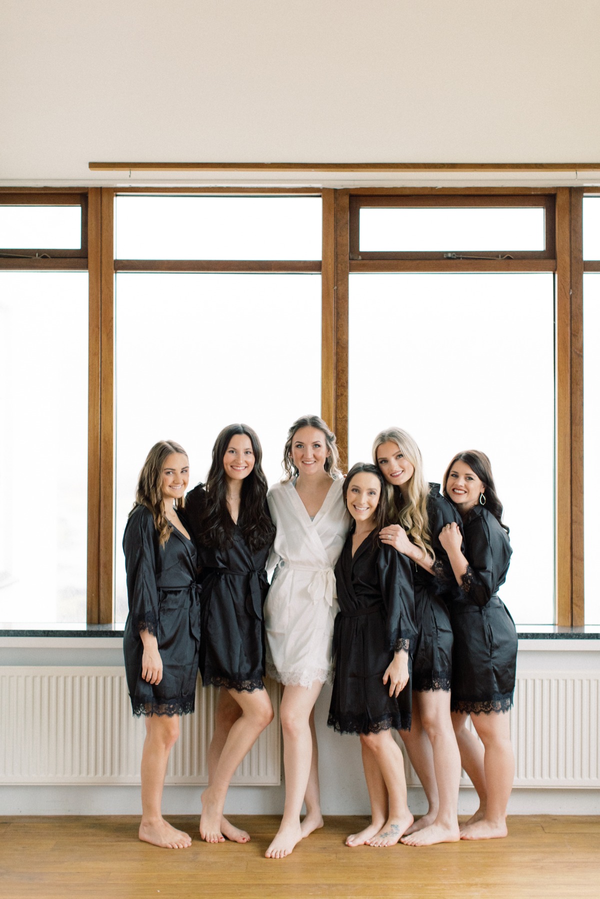 bridesmaids in black robes