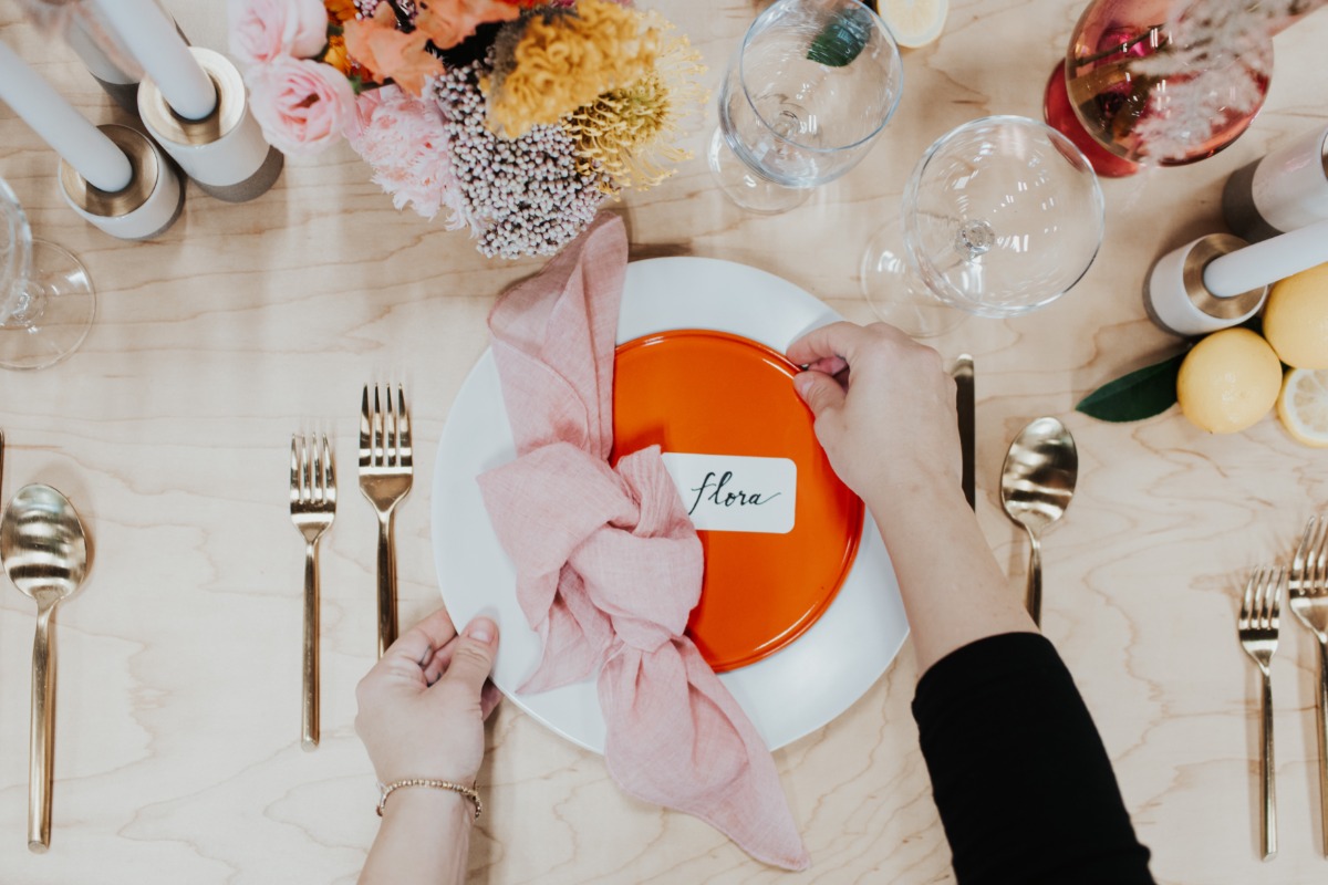 Elegant table setting with floral accents and guest name on plate