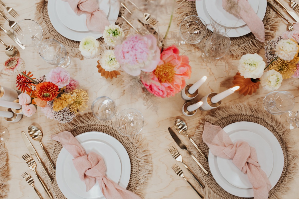 Elegant table setting with flowers and gold cutlery for a special event