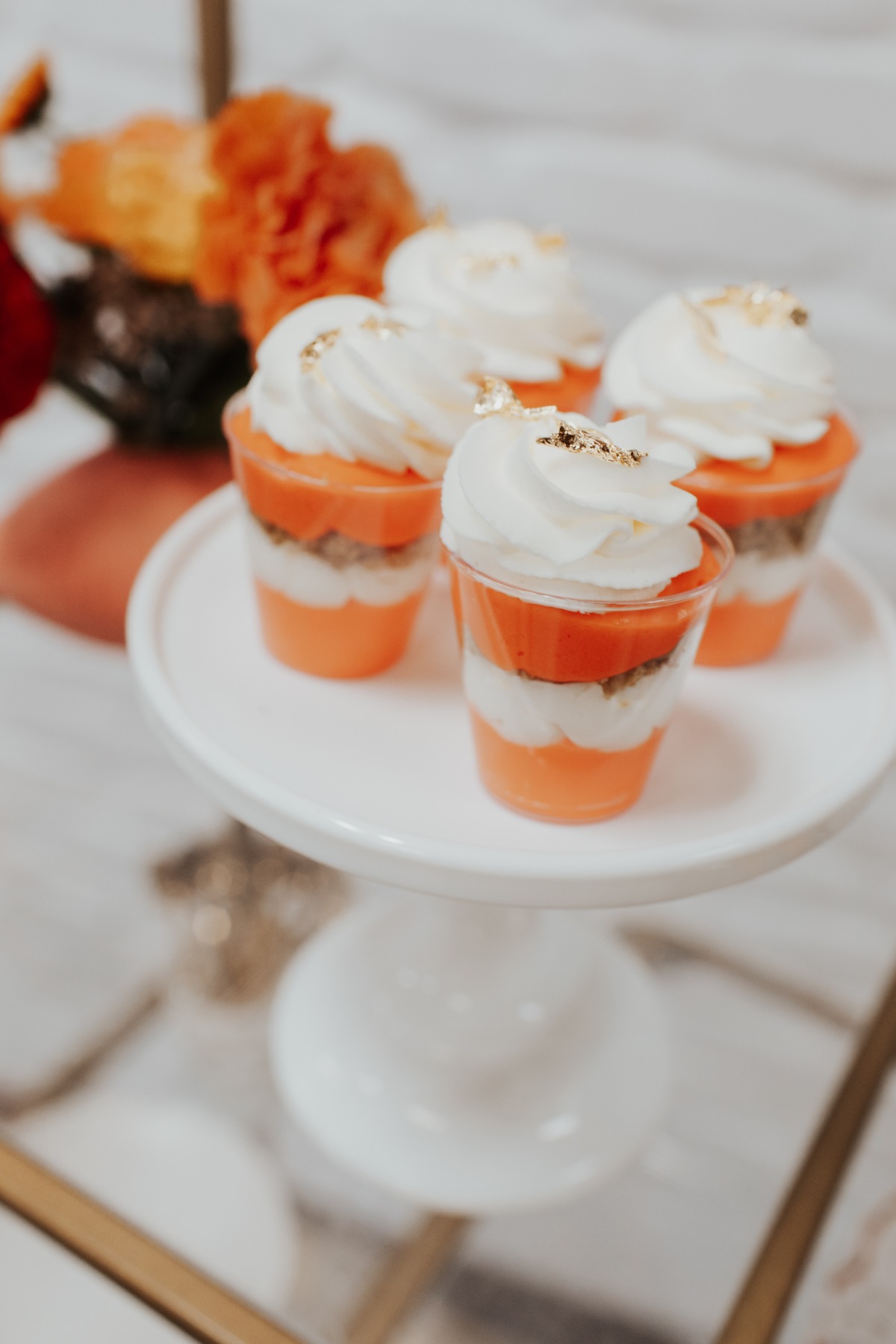 Delicious mini layered desserts with white frosting, ready to eat