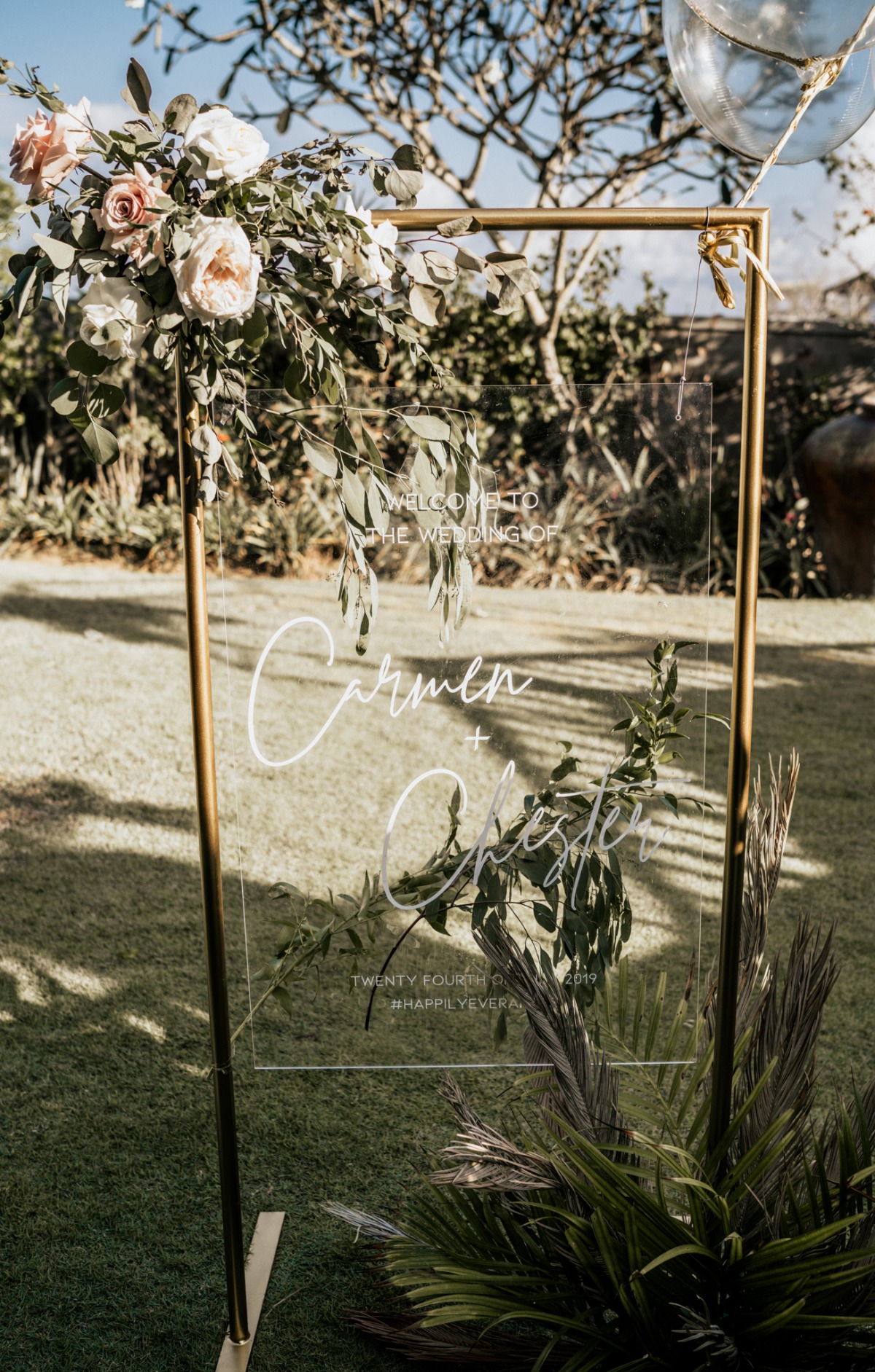 Floral acrylic wedding welcome sign in elegant gold frame
