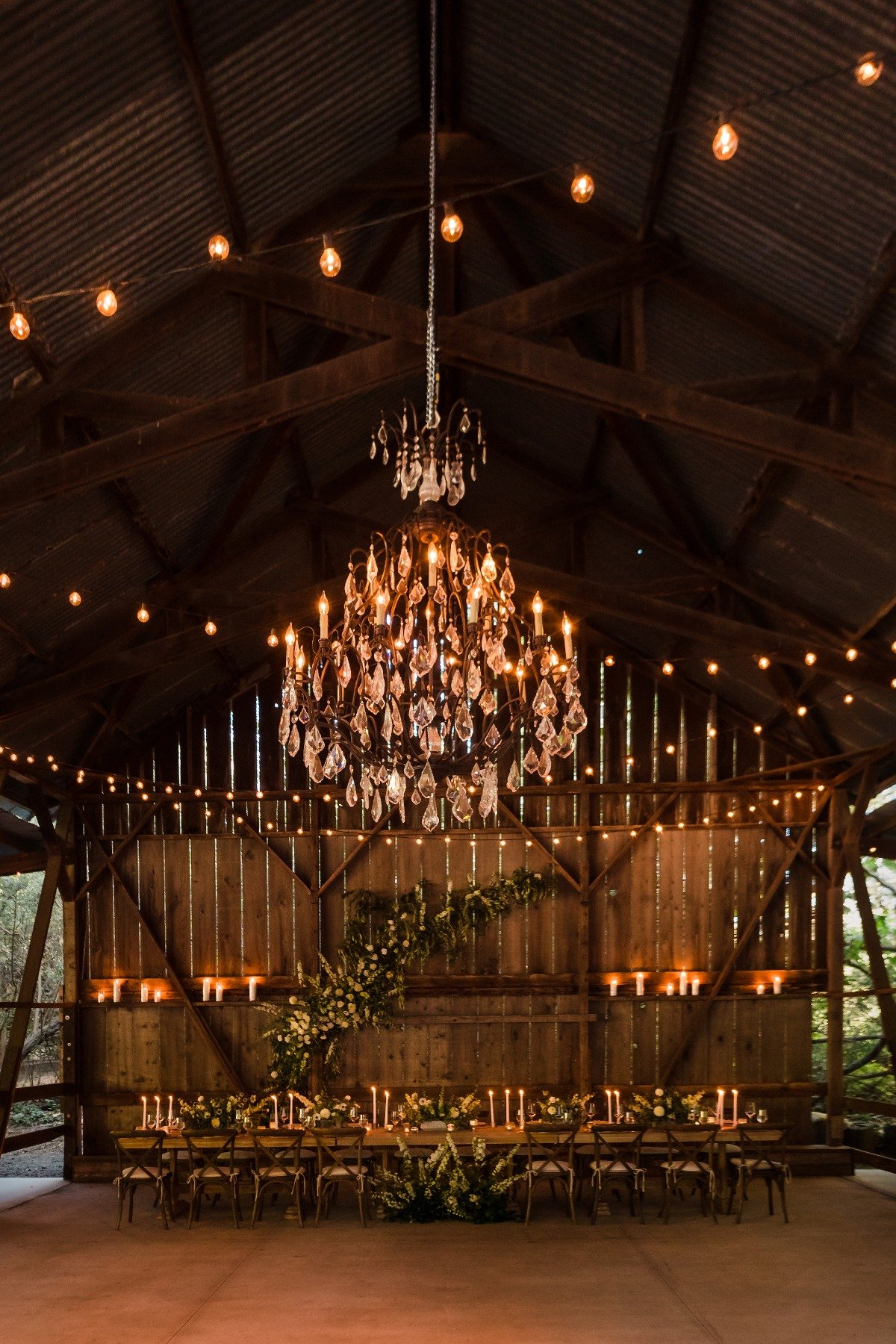 barn wedding reception with chandelier