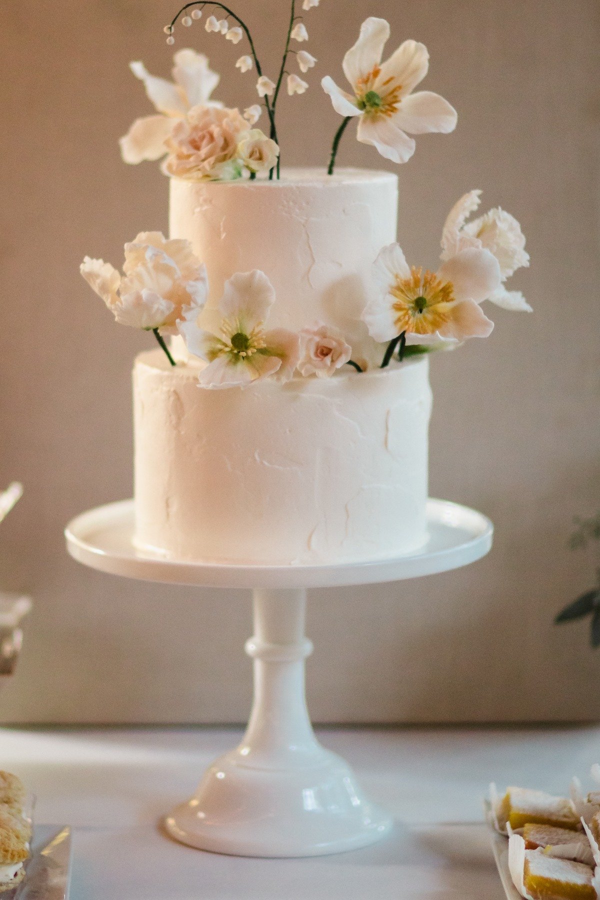 white wedding cake with sugar flowers from Lele Patisserie