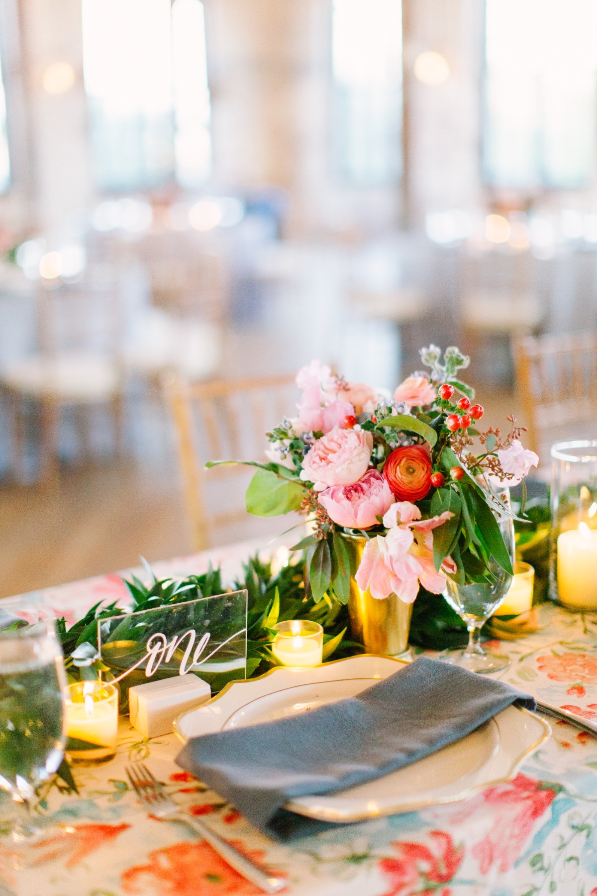 Wedding table setting with floral centerpiece and one sign