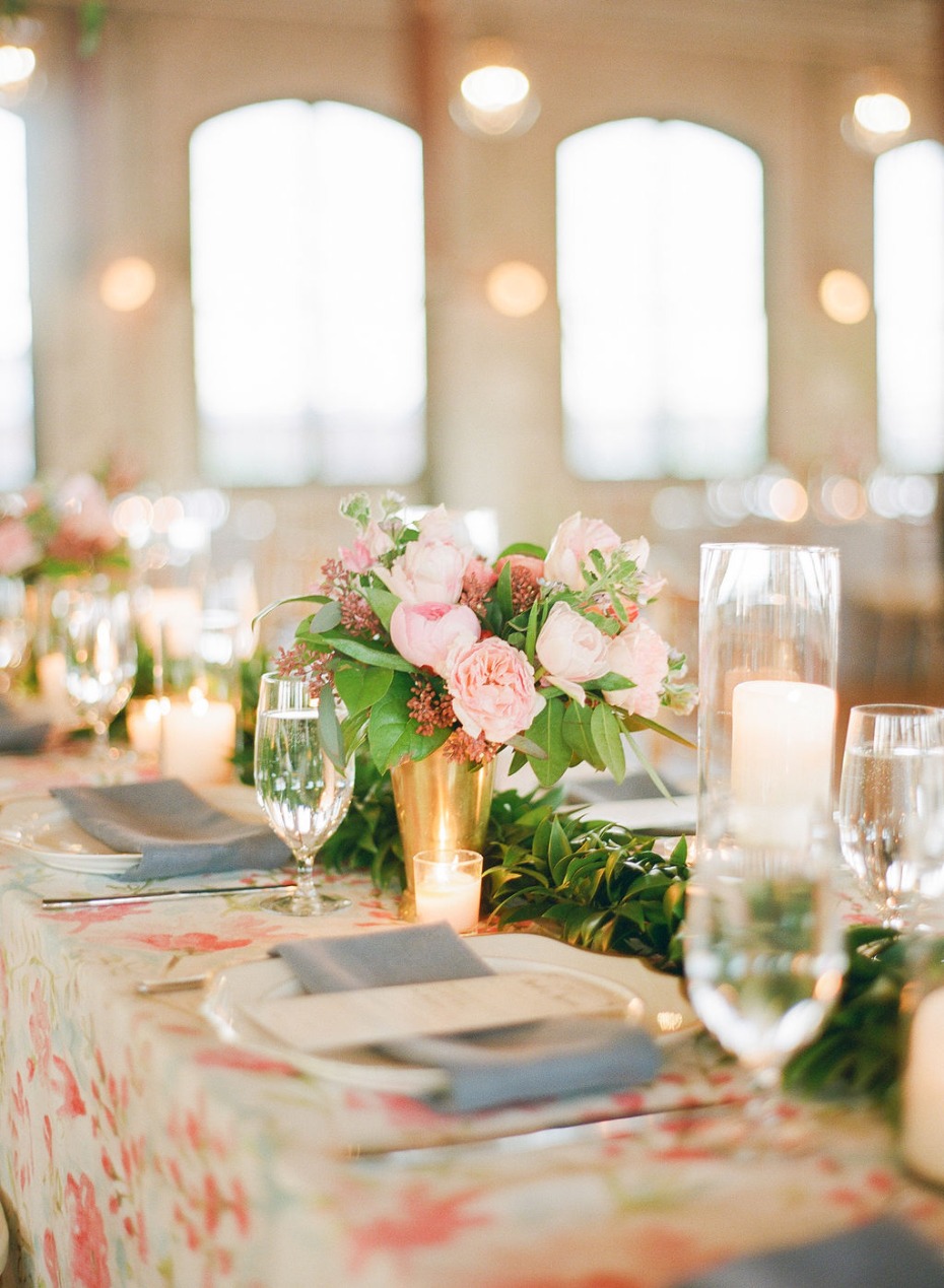 Elegant floral centerpiece on a beautifully decorated wedding table setting