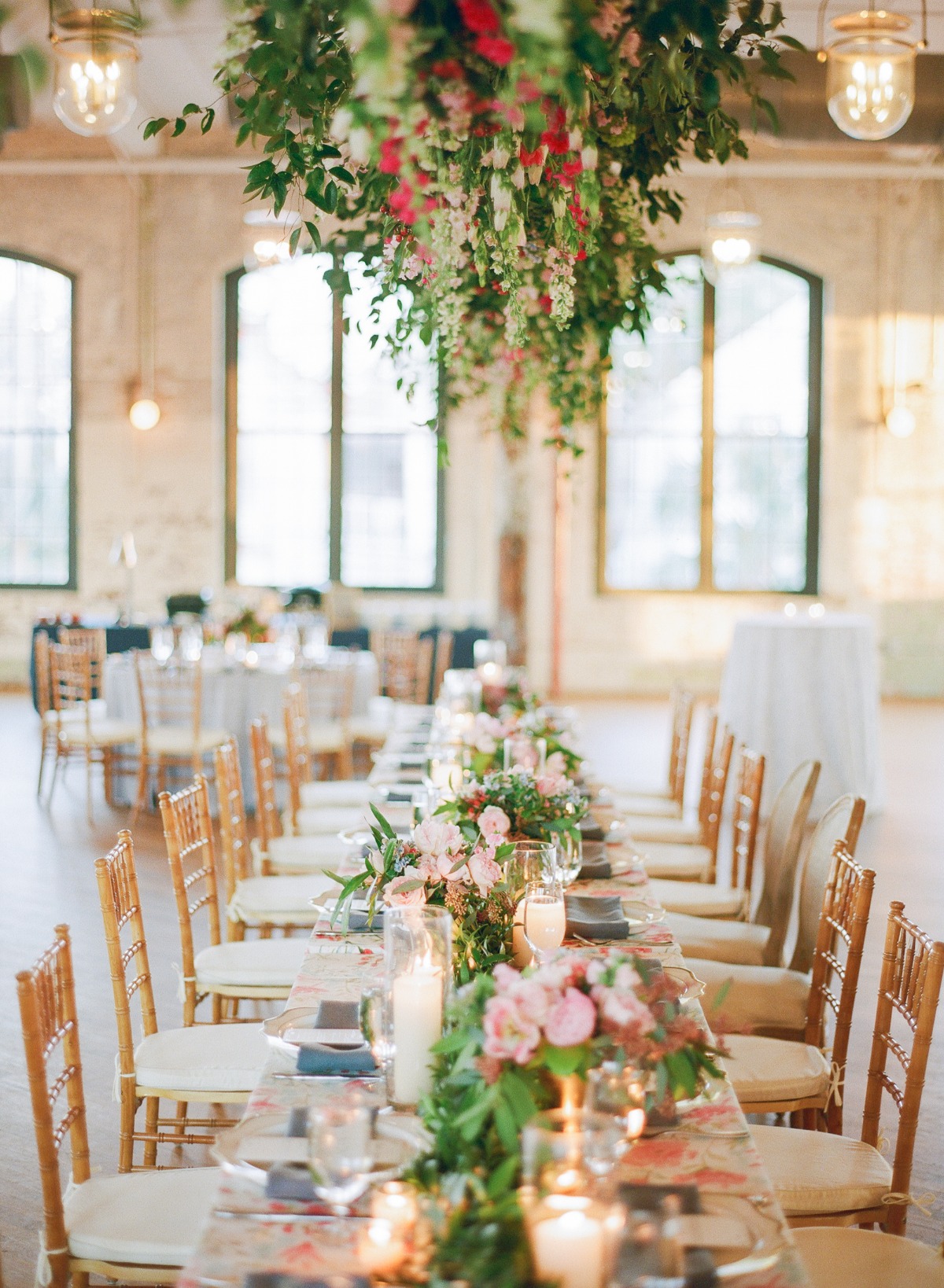 Elegant wedding reception table decorated with flowers and candles
