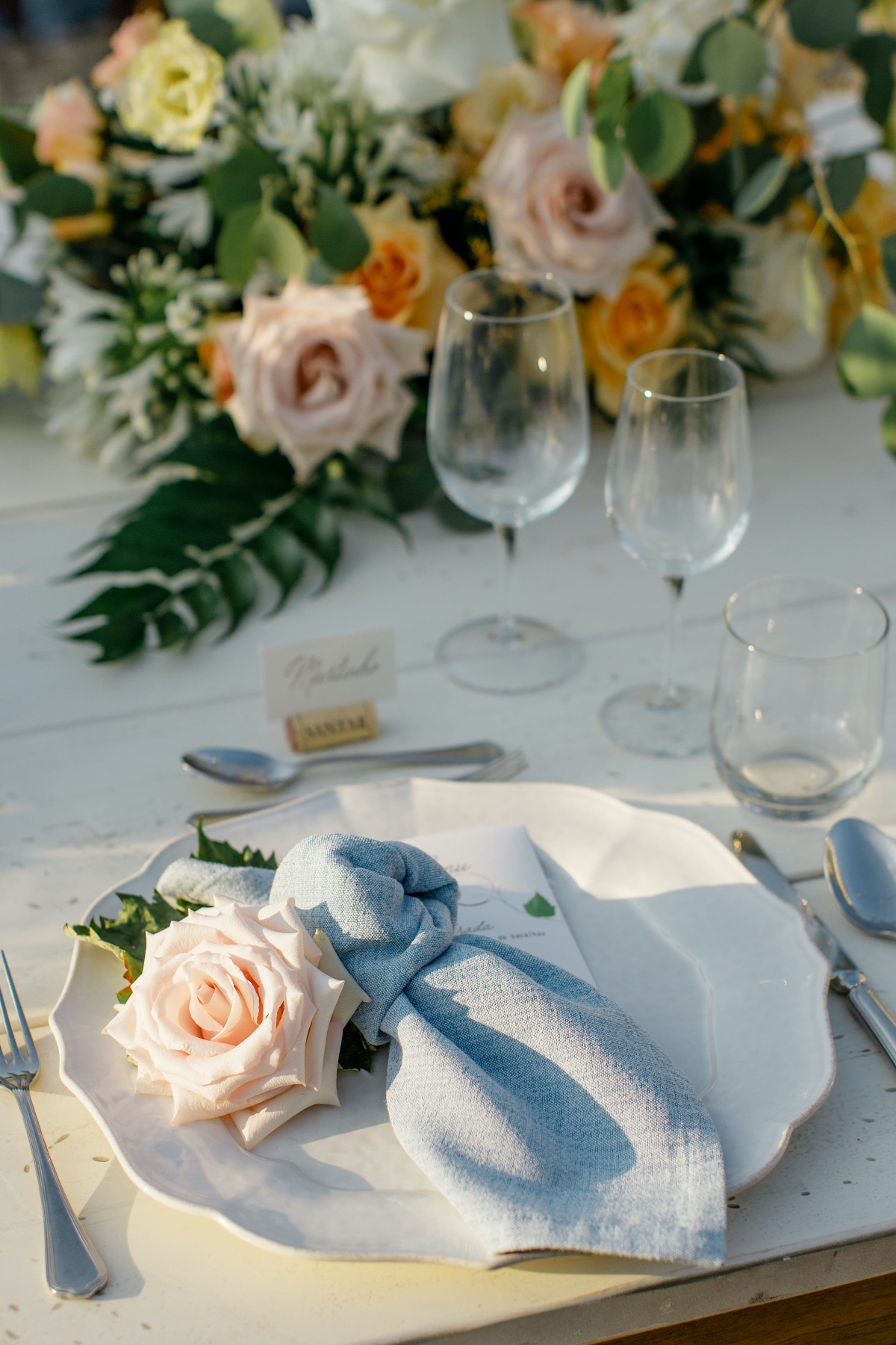 chambray napkins with rose on plate
