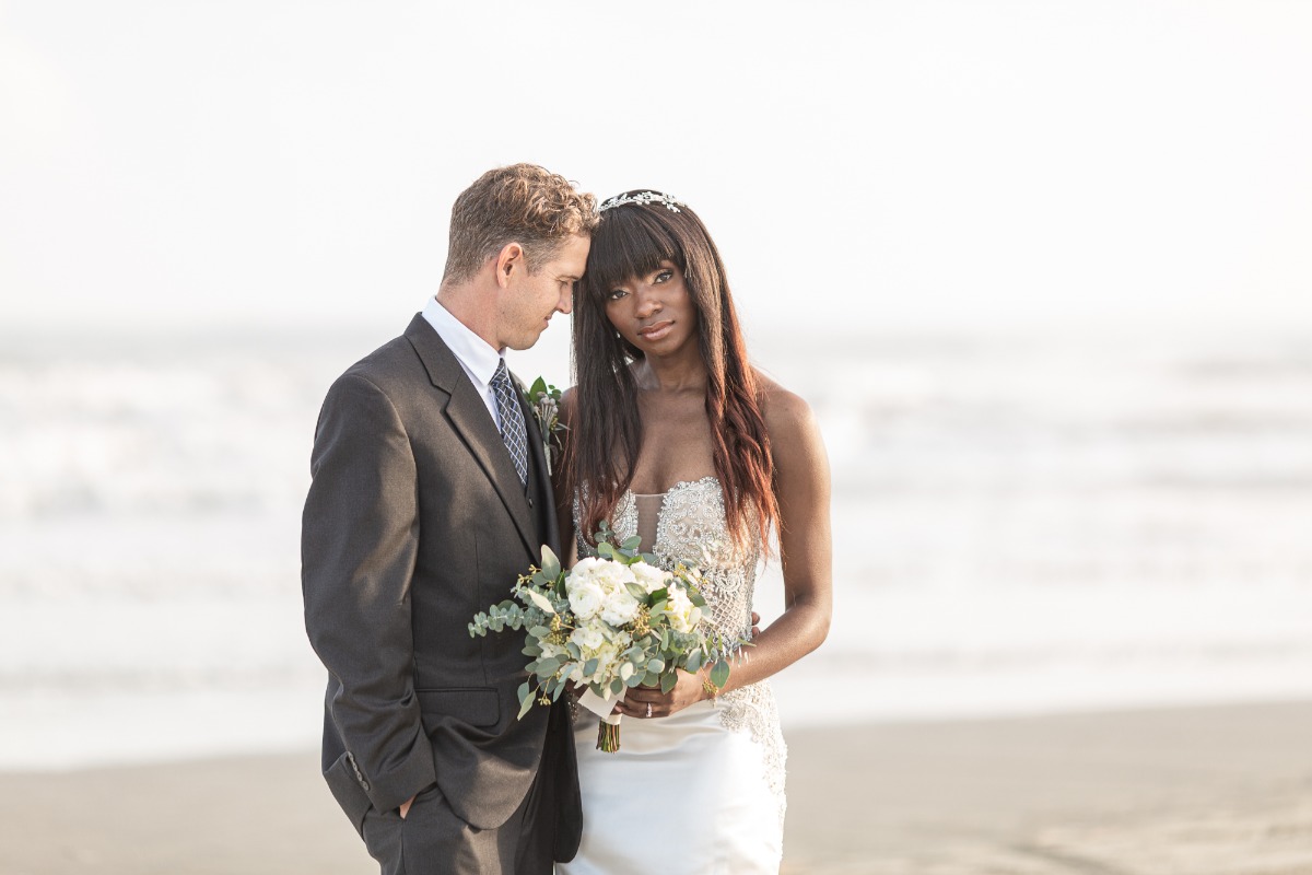 bride and groom pose ideas at the beach