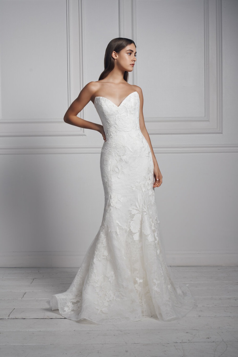 Elegant strapless mermaid wedding dress with floral lace details