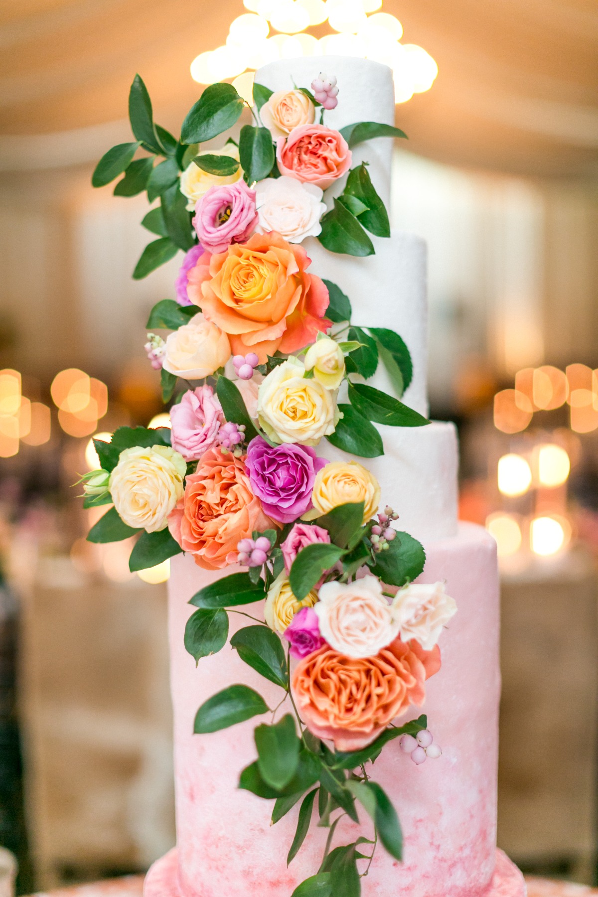 pink wedding cake with fresh florals