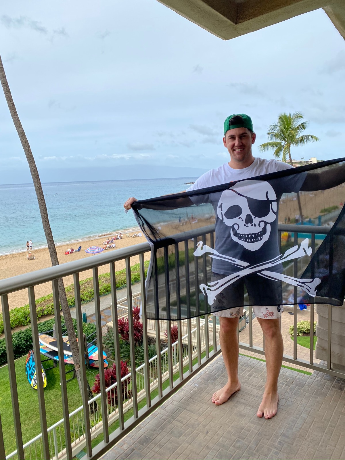 Pirate at the beach with skull and crossbones flag