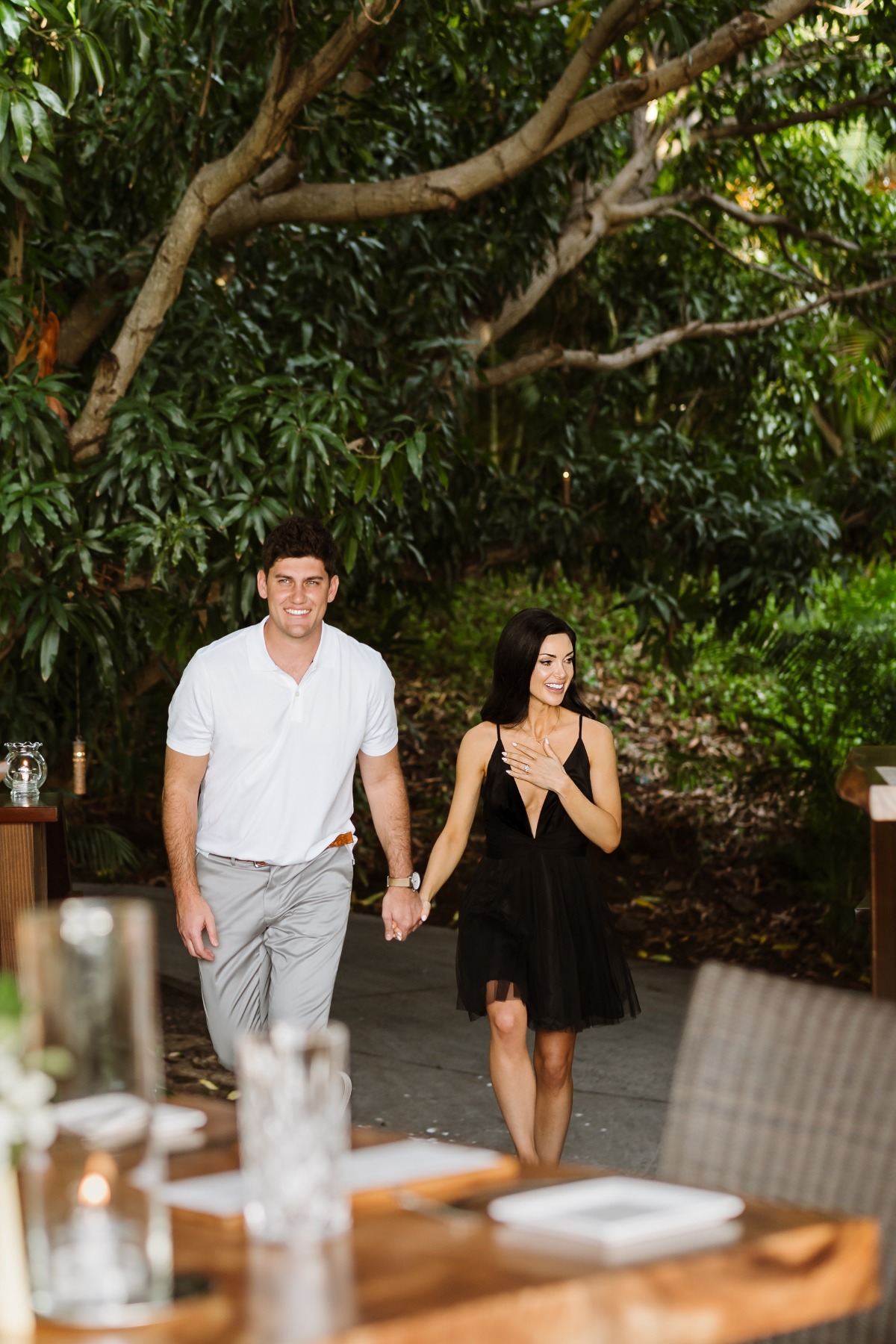 Couple holding hands walking outdoors happy and in love