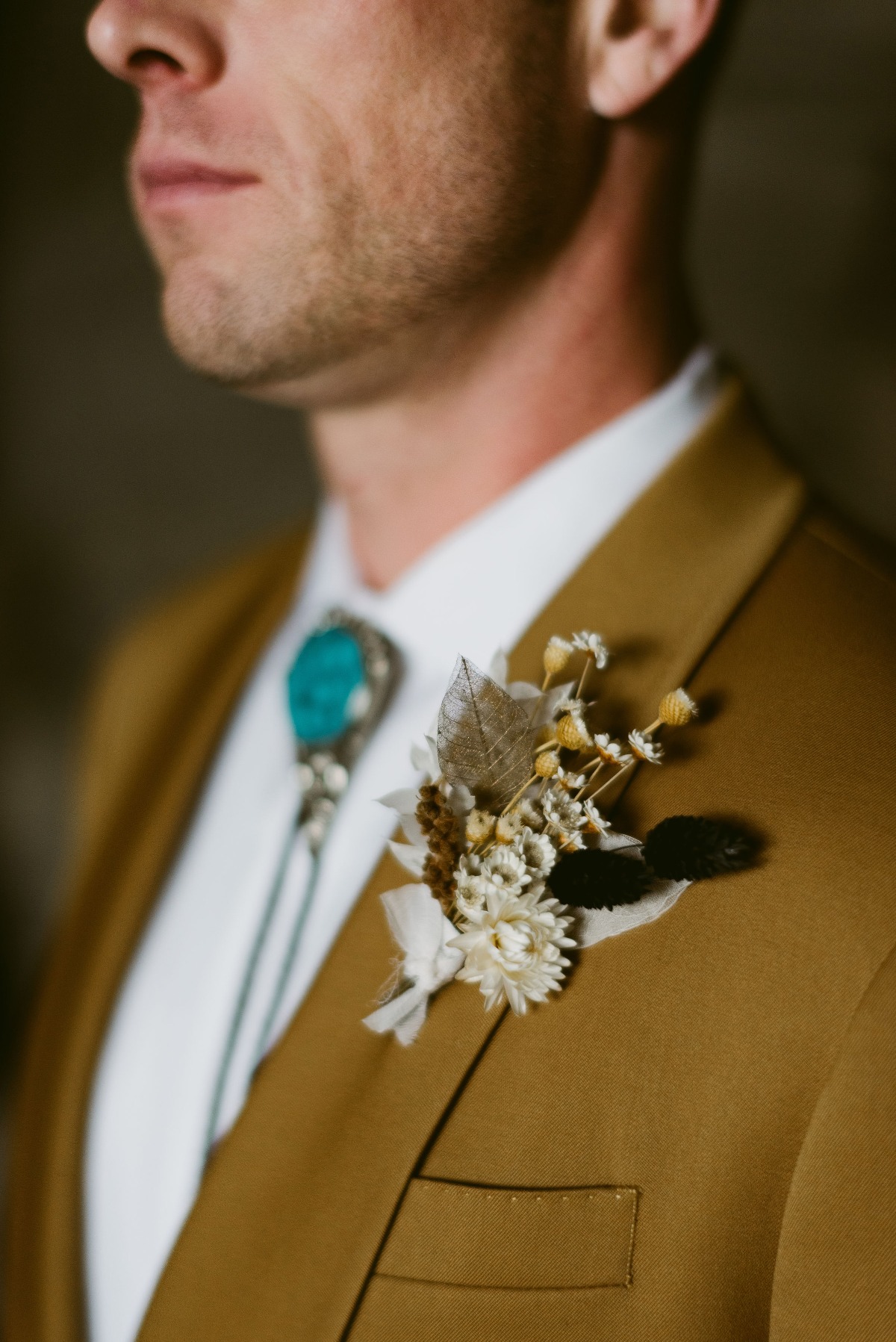 dried boutonniÃ¨re on groom