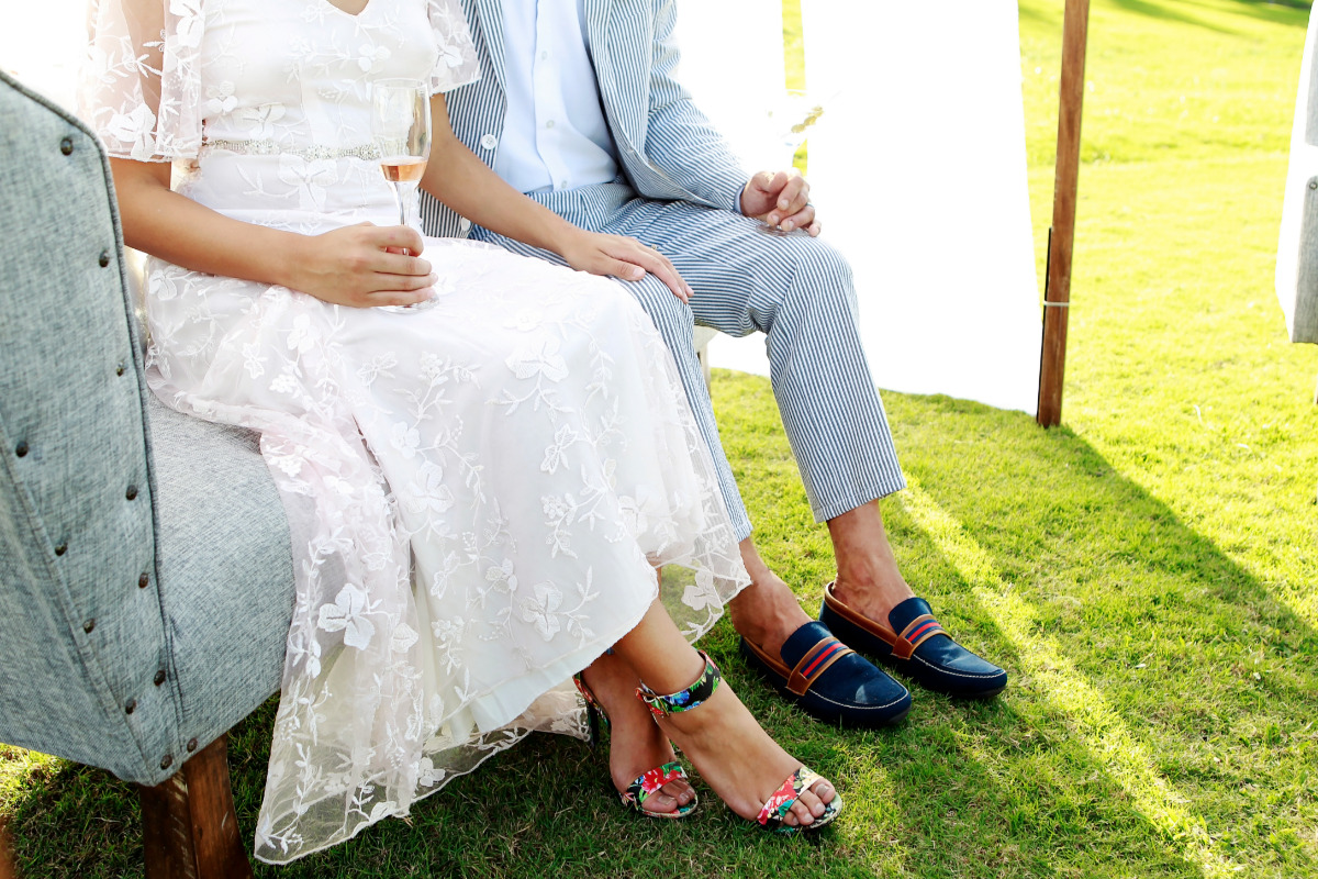 bride and groom in their wedding shoes