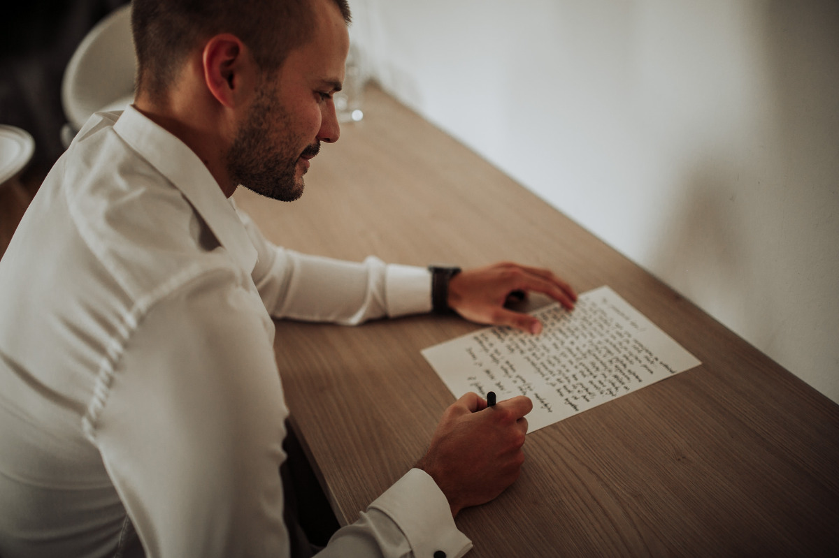 groom writing letter to his bride-to-be