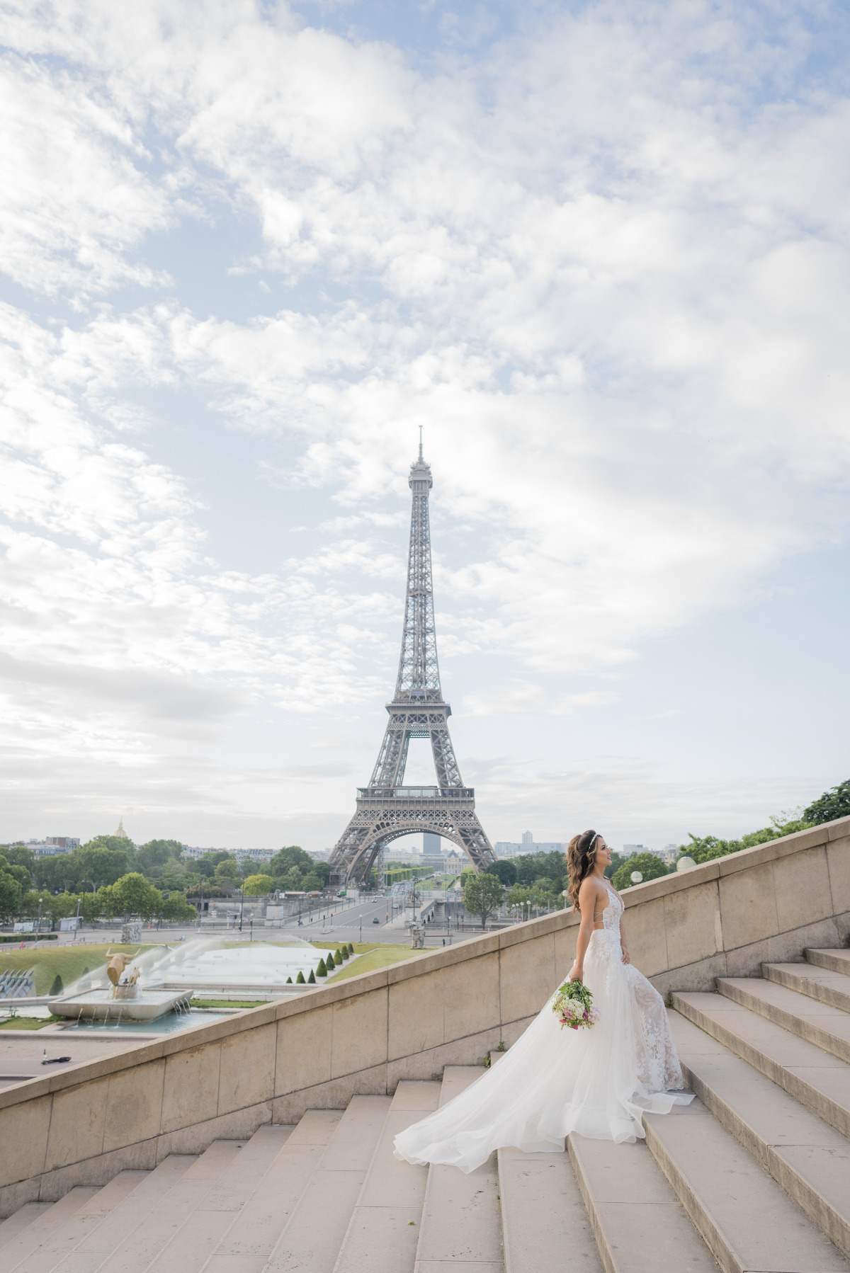 bride walking the stairs at her Paris elopement