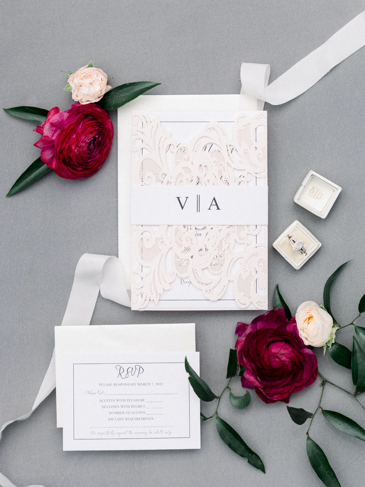 Elegant wedding invitation suite with floral accents