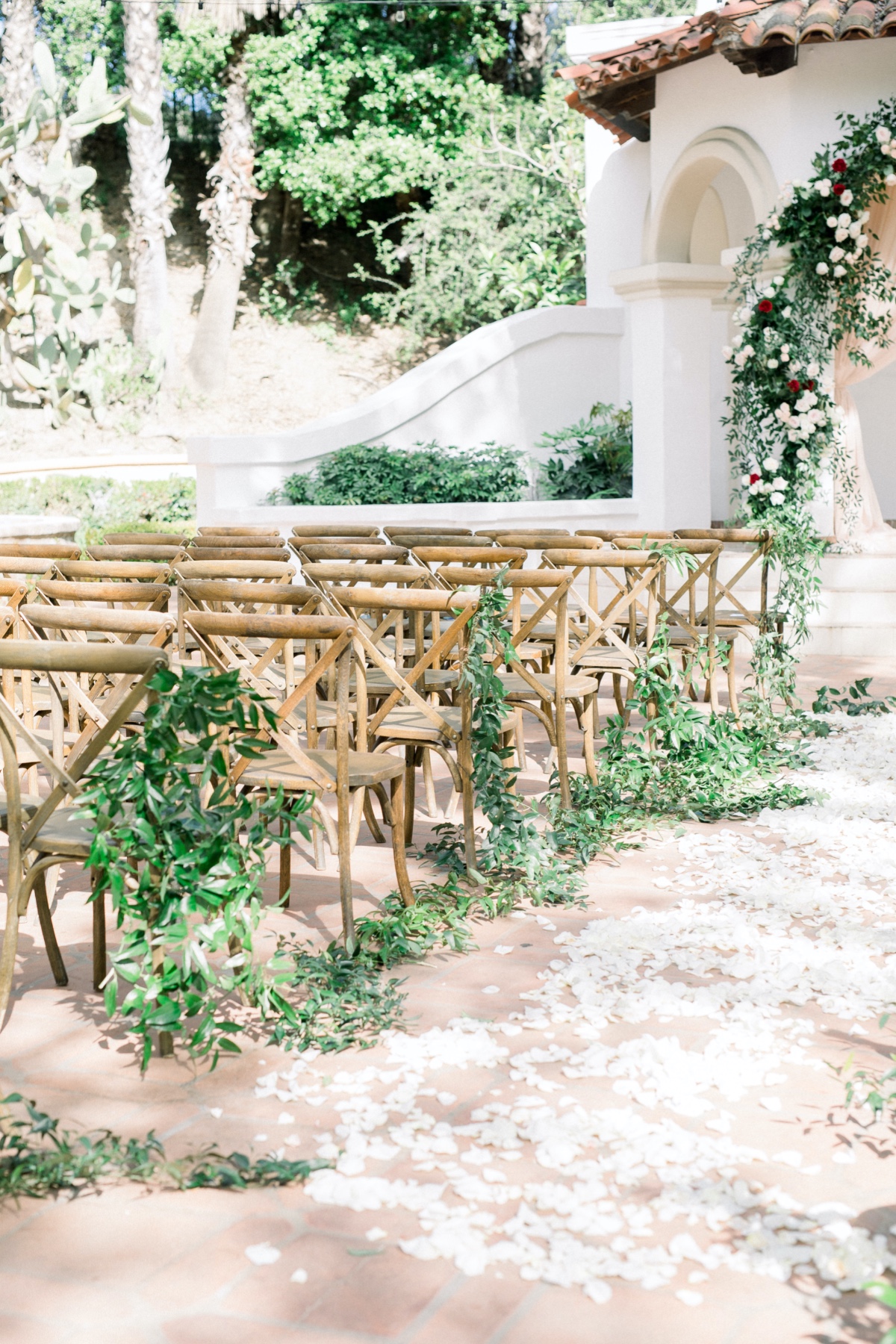 wedding aisle decorated with rose petals