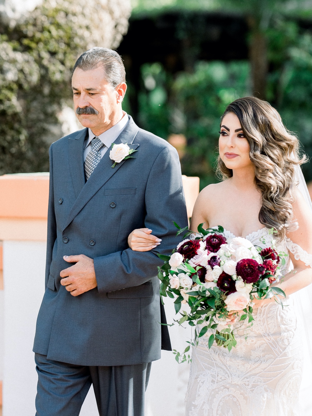Bride with father walking down the aisle flowers bouquet