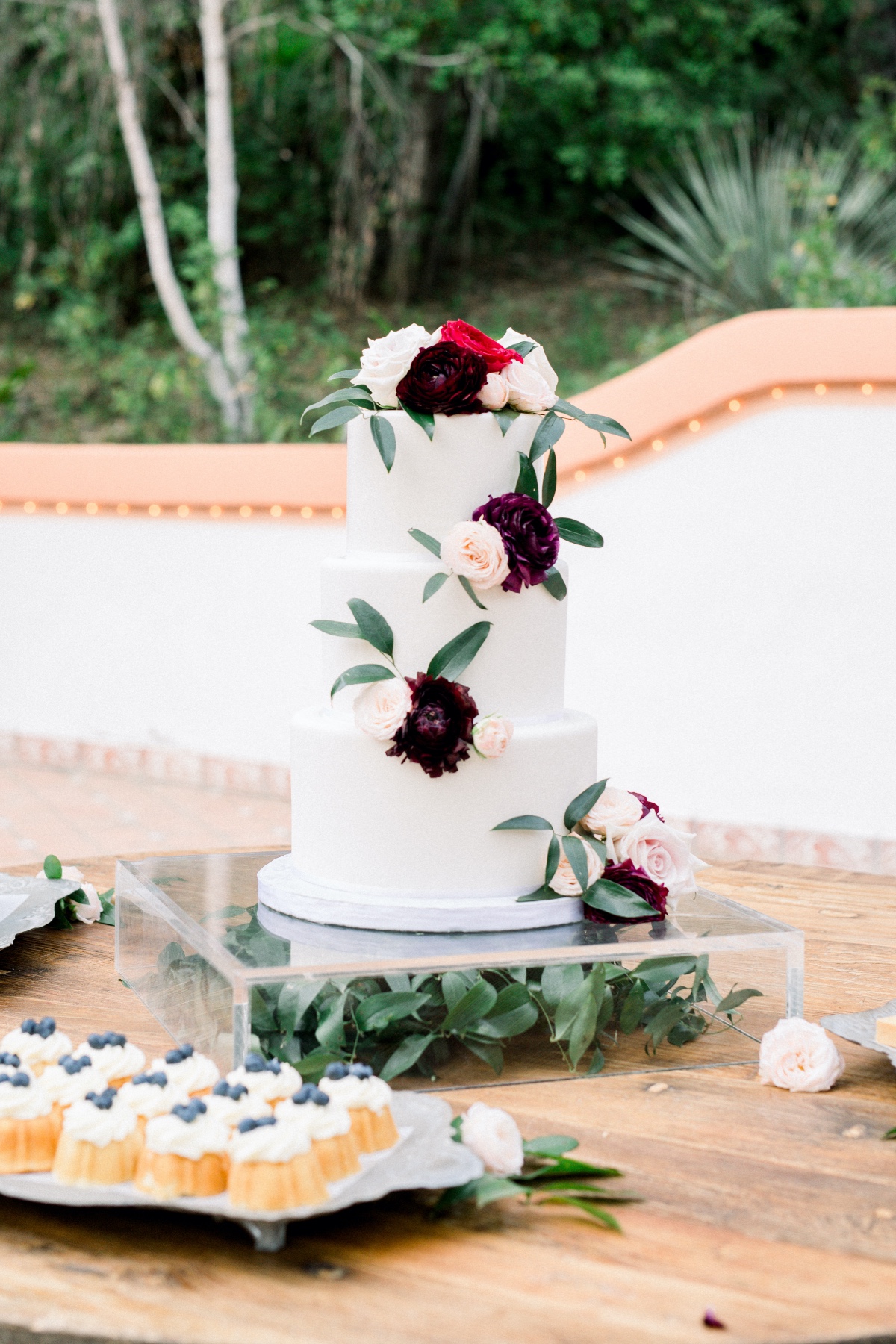 Elegant white wedding cake with floral decorations